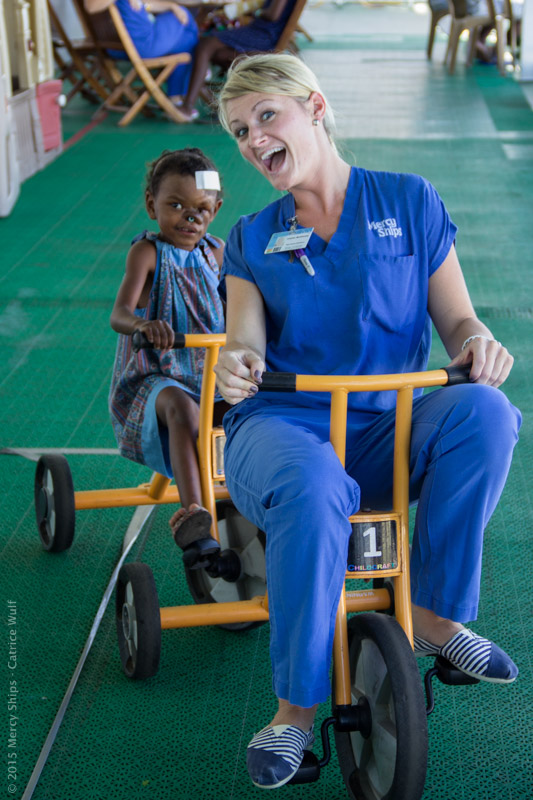Photo Credit Catrice Wulf - Ward nurse Heather Morehouse (USA) palys with Mioty (MGB14013) on Deck 7.